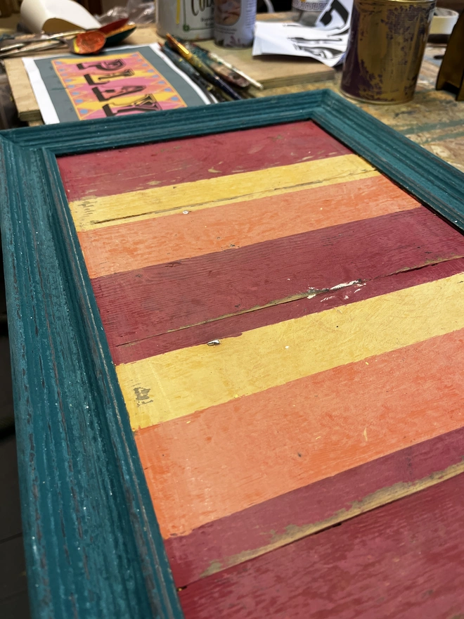 play sign being painted in argent and sable workshop