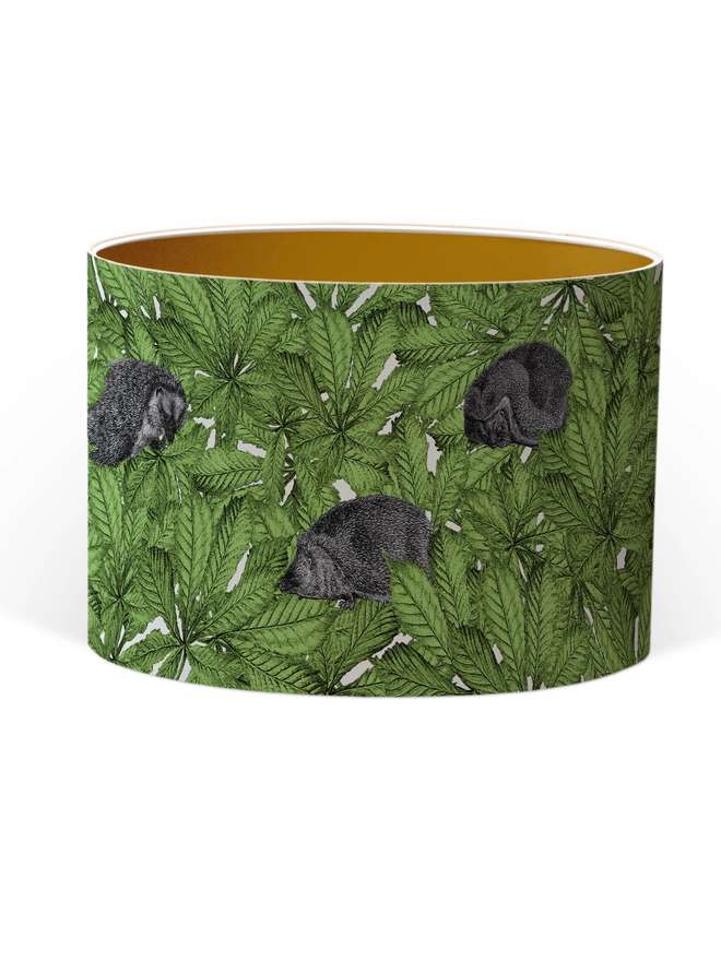Drum Lampshade featuring hedgehogs in green leaves with a Gold inner on a white background
