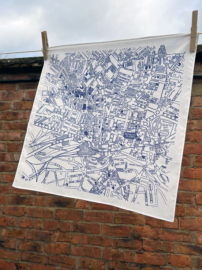 A Mr.PS Leeds Map Handkerchief hangs outside on a washing line
