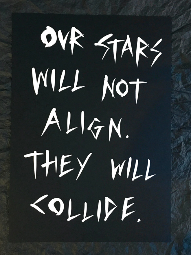 'Our Stars Will Not Align' painting. White ink on black paper.