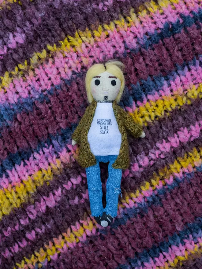 Kurt Cobain inspired doll by Jennifer Jackson seen on a colourful knitted jumper.