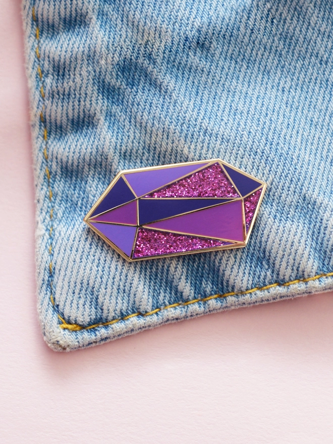 amethyst enamel pink badge on denim jacket