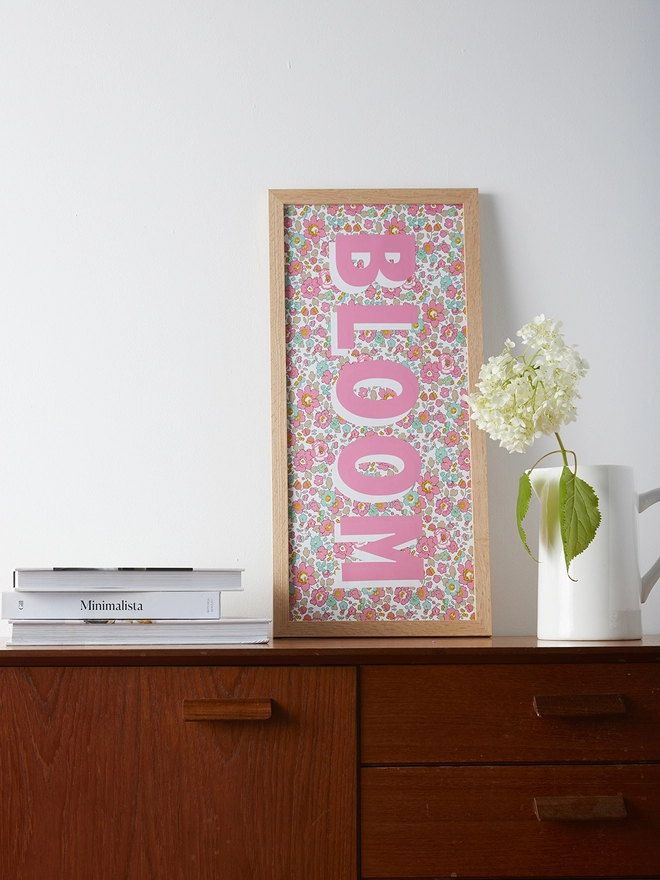 Personalised framed word/name picture in pink with white highlights on Liberty Betsy pink fabric 