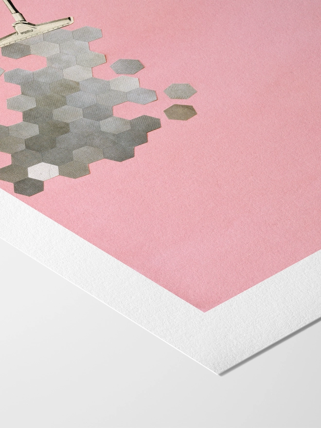 A retro print featuring a woman hoovering up geometric shapes.