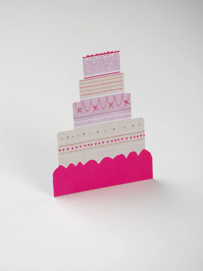 A Happy Cake celebration Card. Freestanding, die cut and neon. 