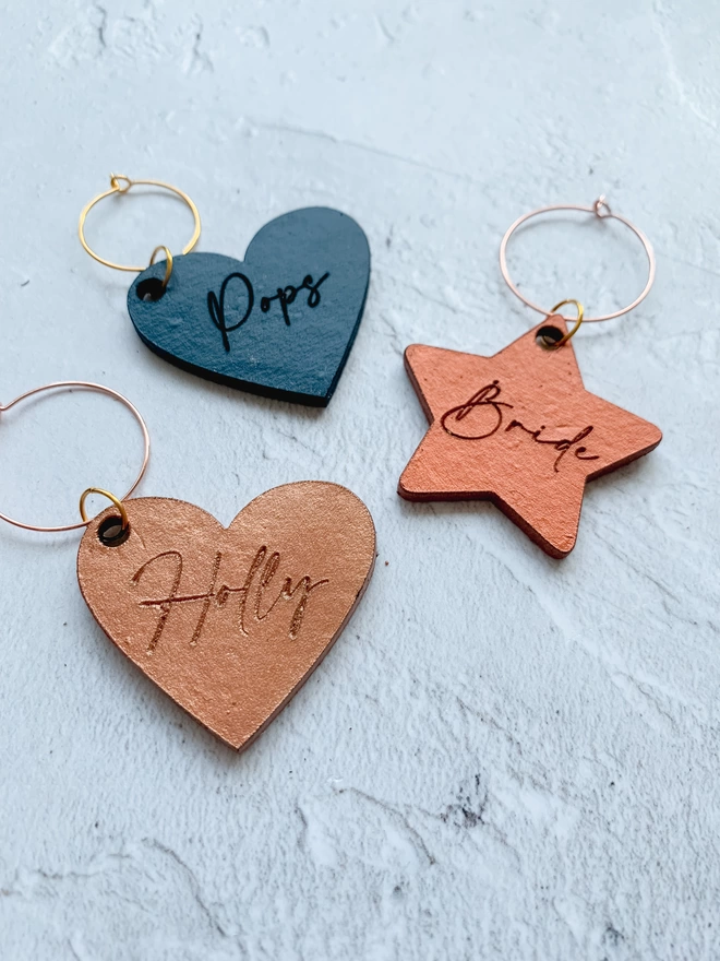 Leather glass charm tags in a heart or star shape. 
