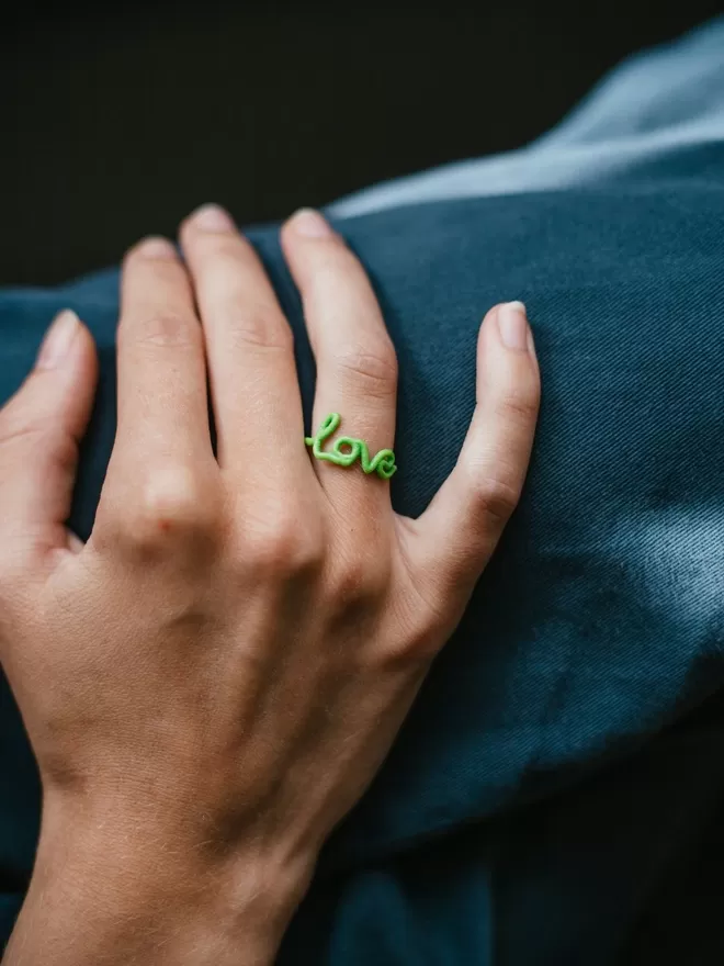 Zoe Sherwood love ring in green.