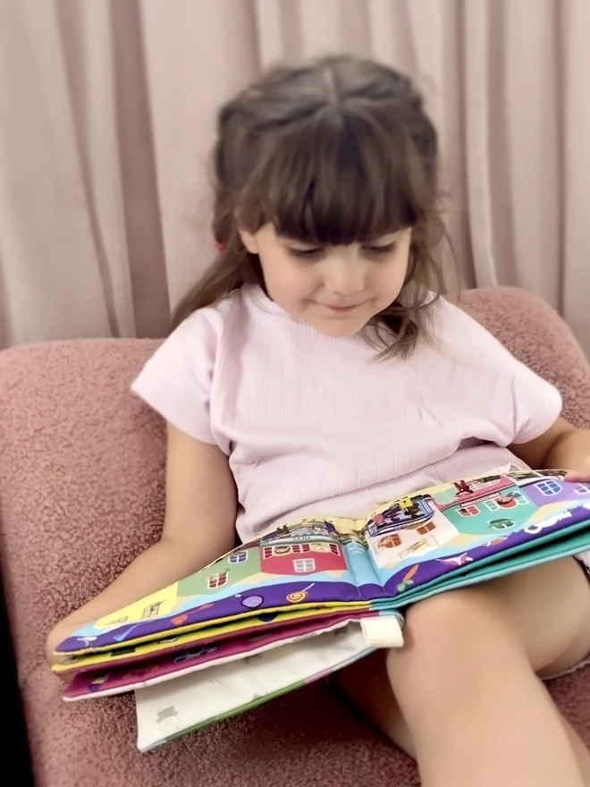 Girl reading Can you find Teddy? Search and find soft book