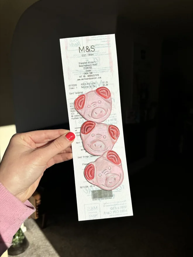 Three Little Pigs M&S Receipt Prints, against a black background. 