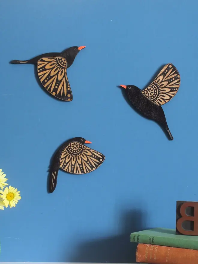 Folk Art Wooden Blackbirds (Set Of 3), group of blackbirds flying hanging on a wall. 