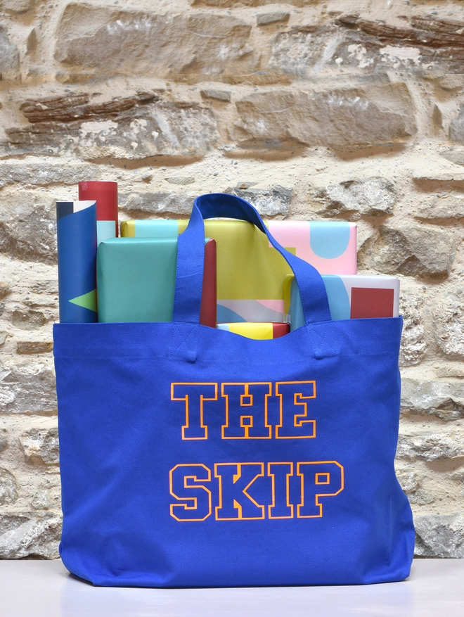 skip blue bag with presents