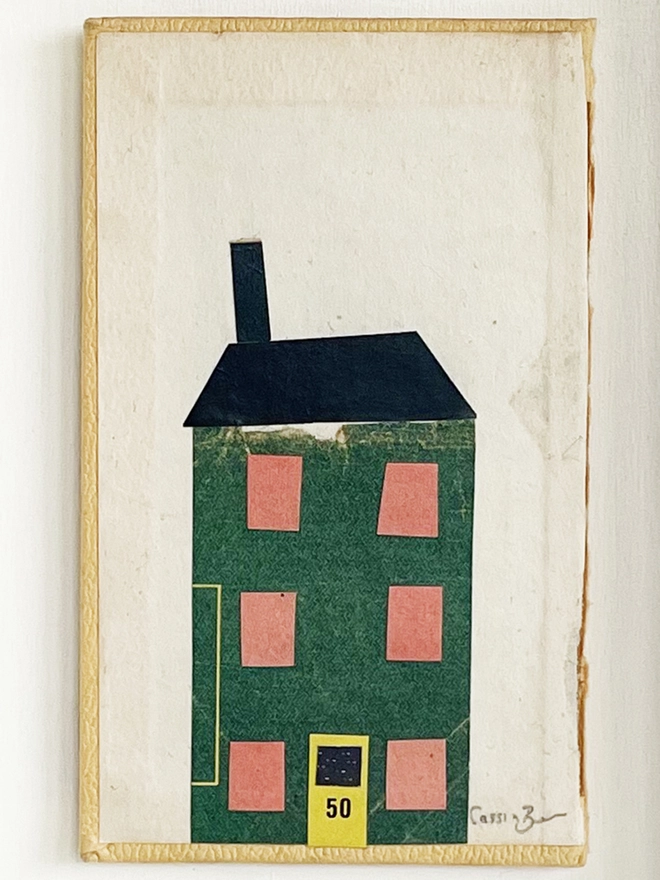 A charming dark green townhouse portrait using vintage paper on an old book cover.