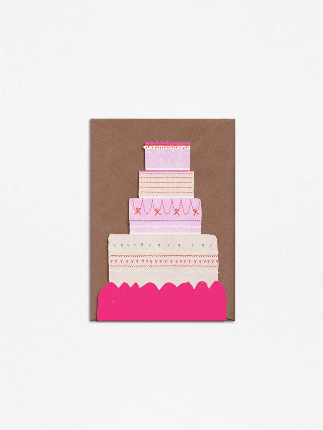 A Happy Cake celebration Card. Freestanding, die cut and neon with A6 kraft envelope.