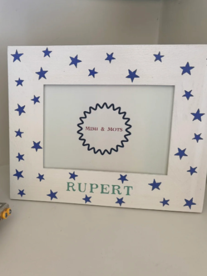 Blue Star Personalised Photo Frame. A white photo frame decorated with blue stars.