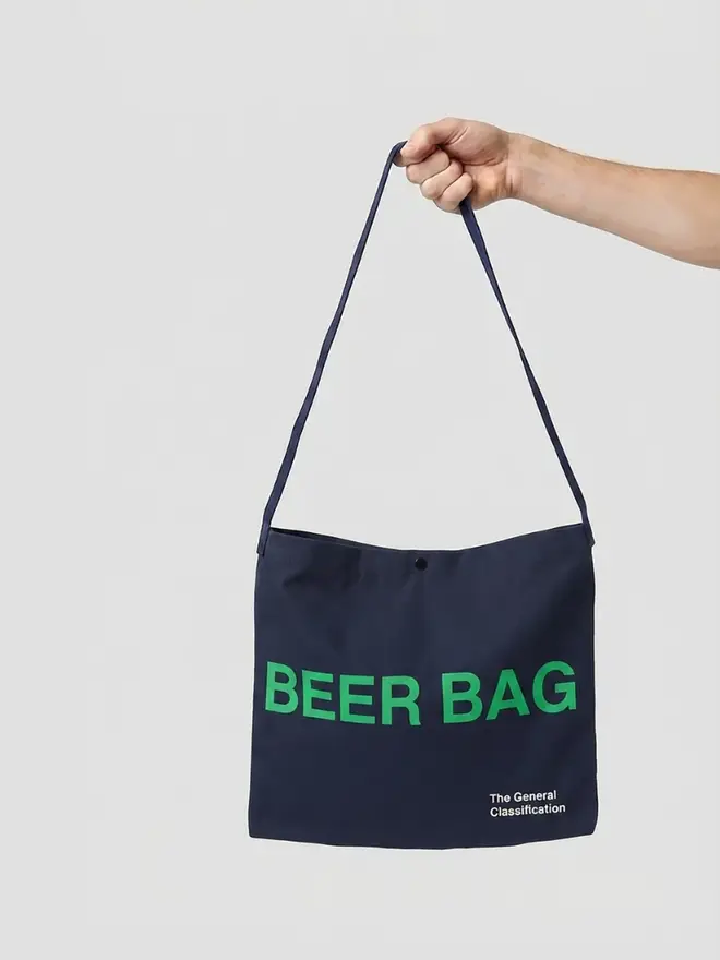 'Beer Bag' Musette Bag, against a grey background. 