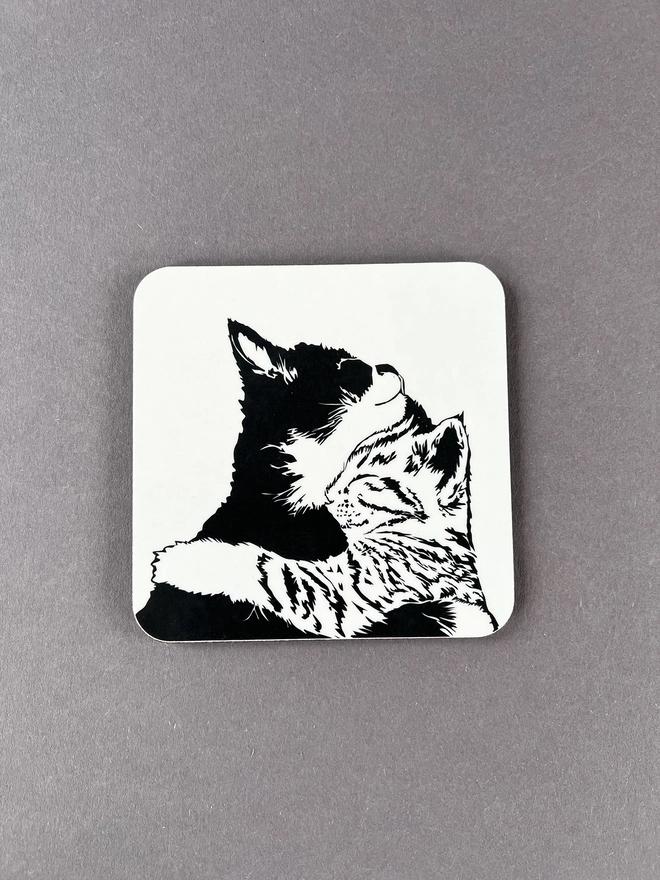 Melamine coaster illustrated with two cuddling cats