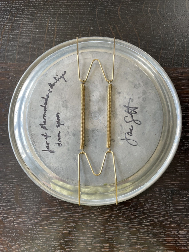plate hanger on pewter plate