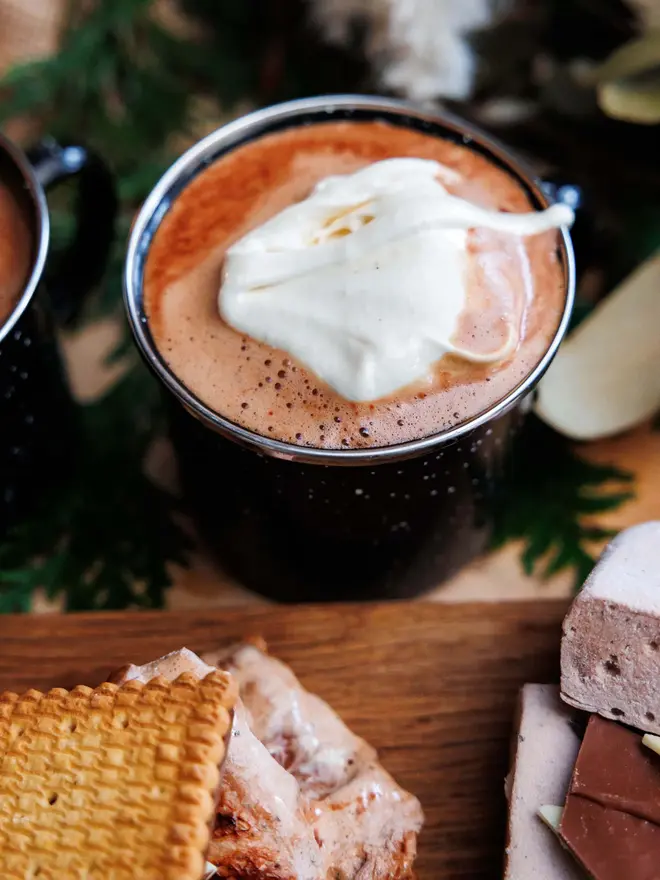 Vanilla Wonder Fluff Tub, a hot chocolate with fluff. This is surrounded by lots of other sweet treats. 