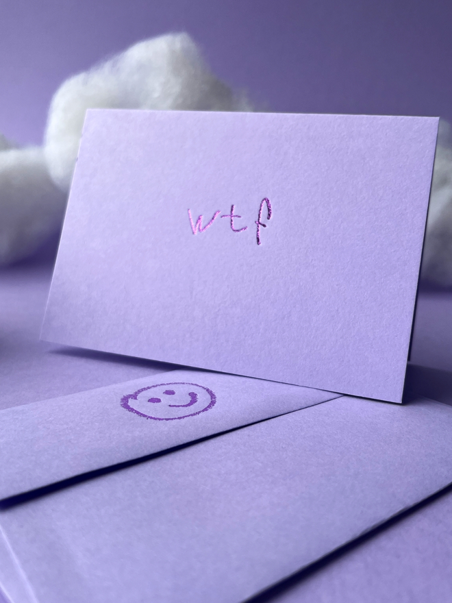 lavender coloured card with wtf short for 'what the fuck' hand foiled in kids hand writing