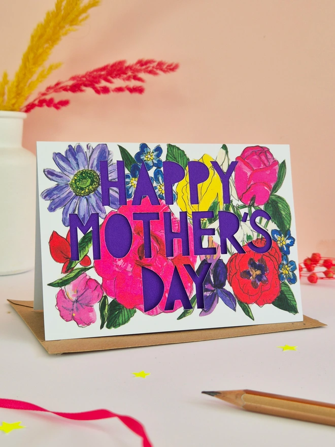 Bright floral illustration with Happy Mother's Day text and bright purple liner 