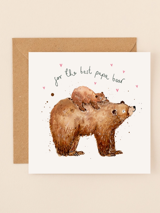 An endearing illustration of a father bear carrying its playful cub on its back, both exuding warmth and affection. The handwritten message "For the Best Papa Bear" is displayed above them, adding a personal touch. The design combines earthy tones and soft textures, capturing the bond between father and child.