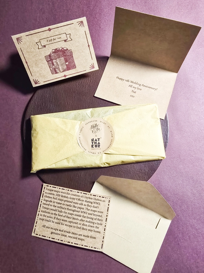 a gift wrapped leather pen case by natthakur with a personalised gift card and message