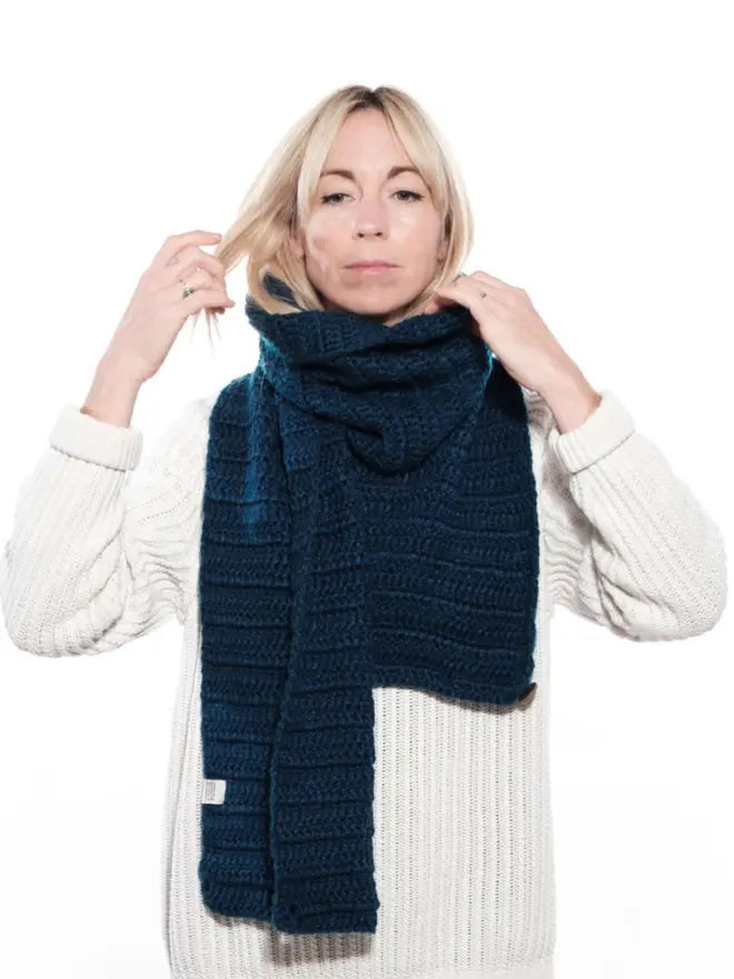 Woman in chunky crocheted scarf