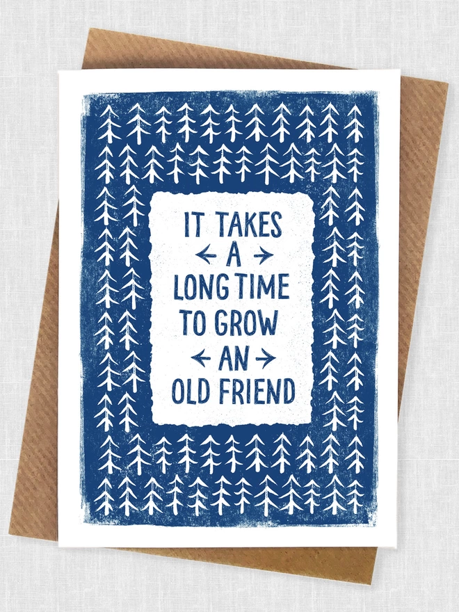 Old Friend card blue and white design with hand drawn trees on a brown kraft paper envelope