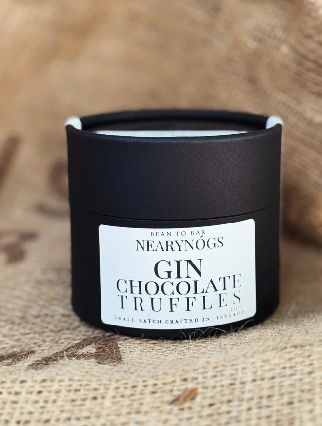 Chocolate Truffles, a tub of chocolate truffles sitting on a sack. 