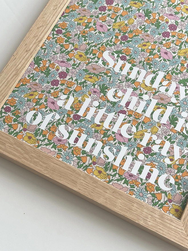 Close up of Sunday's child is a little ray of sunshine framed Liberty picture