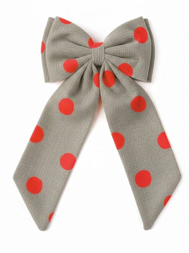 Over Sized Linen Polka Dot Bow Hanging Christmas Decoration, neon orange polka dot bow placed in front of a white background. 