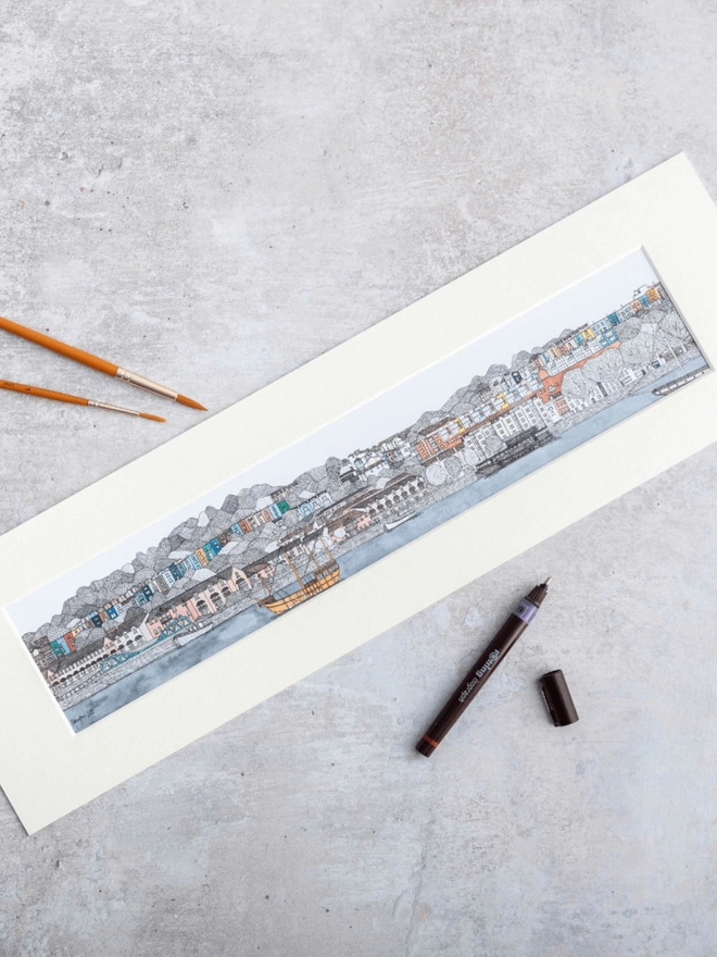 Print of detailed pen and watercolour drawing of Bristol harbour and colourful houses, in a soft white mount