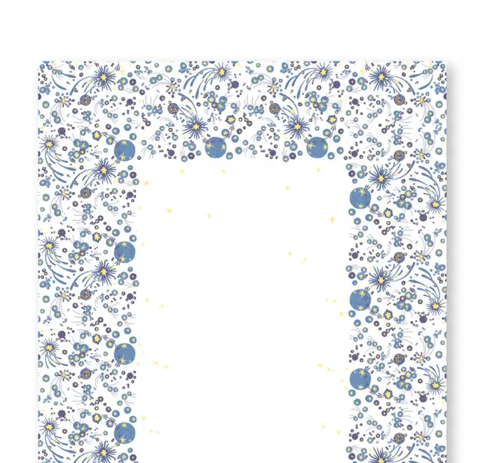Solaris Tablecloth In White Or Blue. White tablecloth with blue and yellow starburst motifs on a white background. 