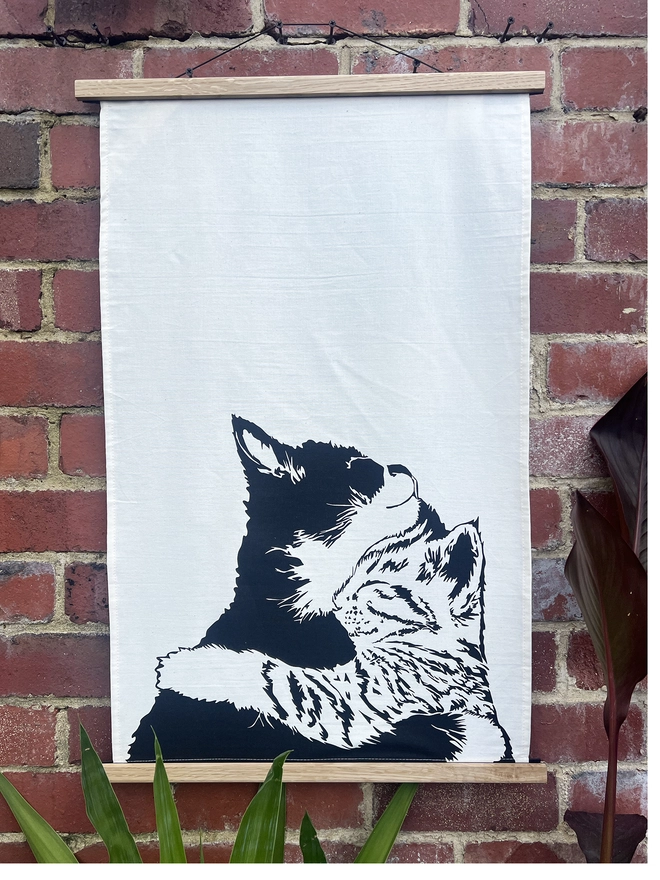 Full image of 'Cuddle time' tea towel with hand sewn edges