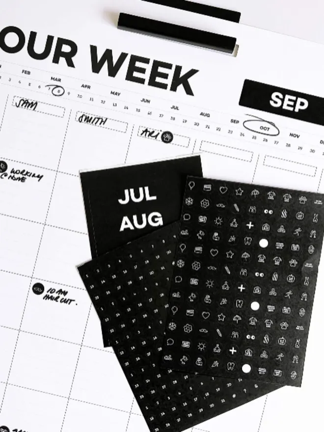 Hello Time weekly wall planner with black sticker sheets for months and icons