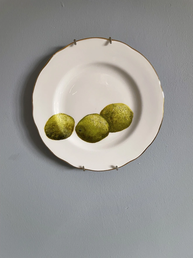 painted limes on vintage plate