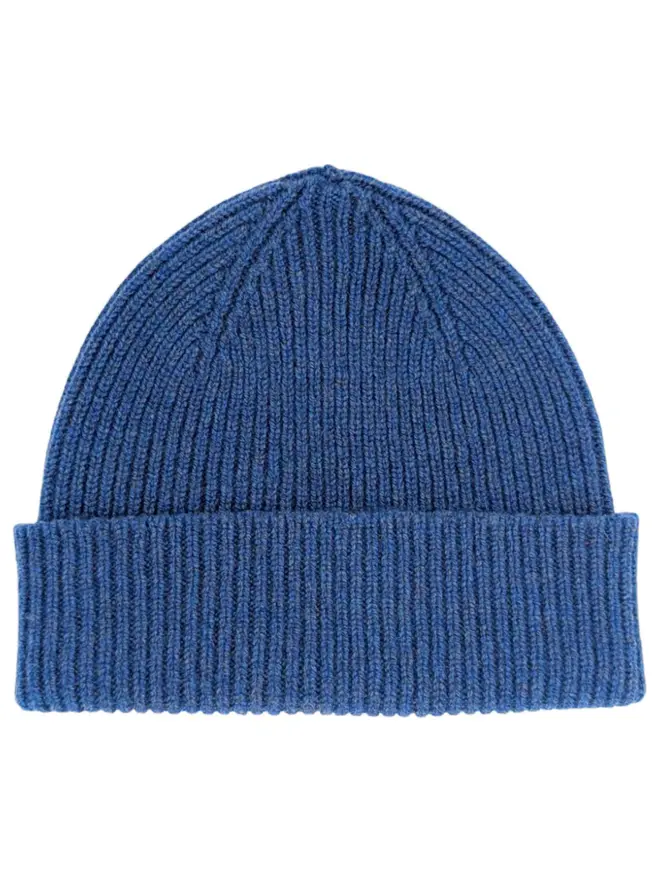 Ribbed Lambswool Unisex Beanie, a colourful ribbed beanie sitting on a white surface. 