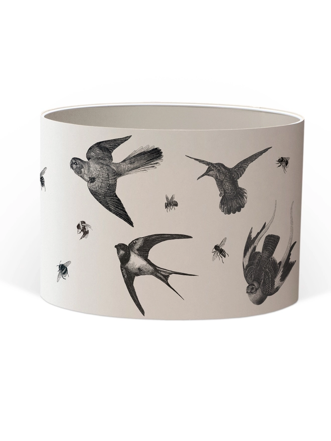 Drum Lampshade featuring birds and bees with a gold heart with a white inner on a white background
