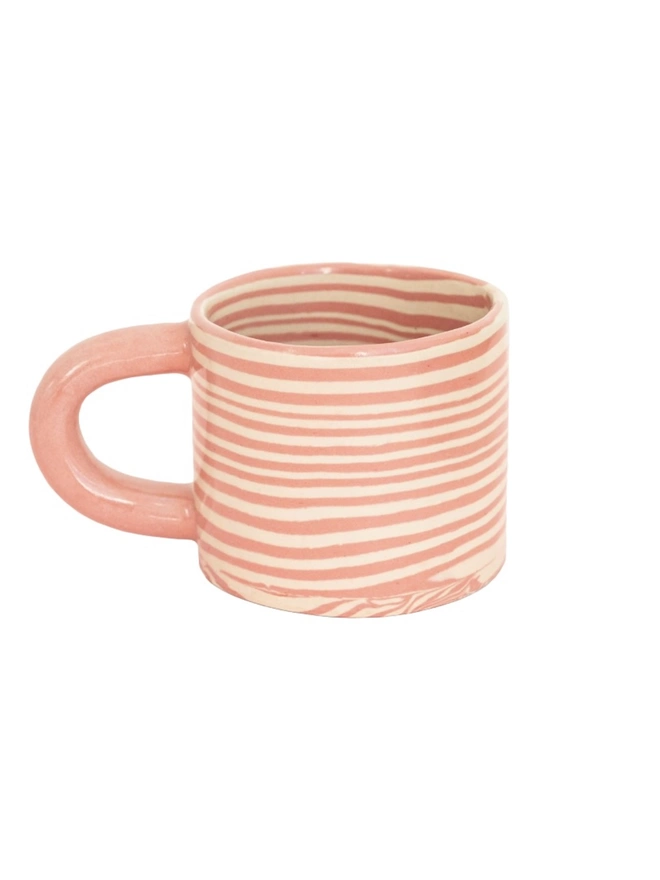 Pink Striped Mug, a pink striped mug sitting on a plain surface against a white backdrop. 