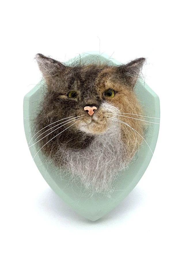 A custom needle-felted cat portrait on a custom painted wooden shield