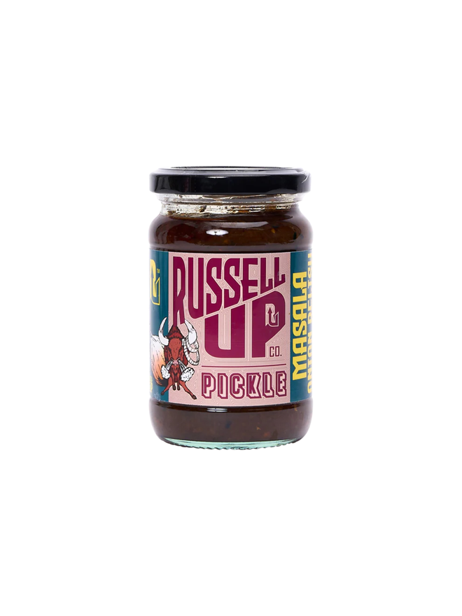 masala onion relish. a jar of onion relish photographed against a white background, featuring a horned bull blowing steam on the label.