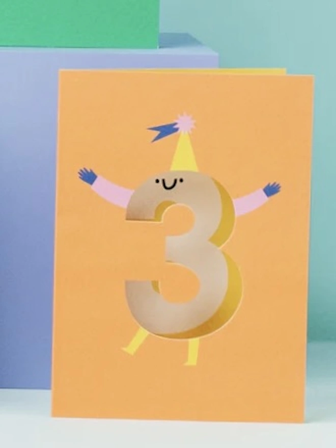 3rd Birthday Card, against a blue background with other birthday cards surrounding it. 