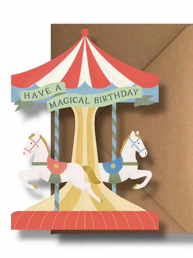 have a magical birthday carousel card. illustrated carousel cut out birthday card with horses.