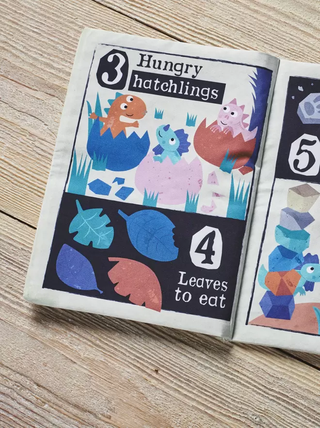 Dinosaur Counting 1-10 crinkly cloth book open at page 1