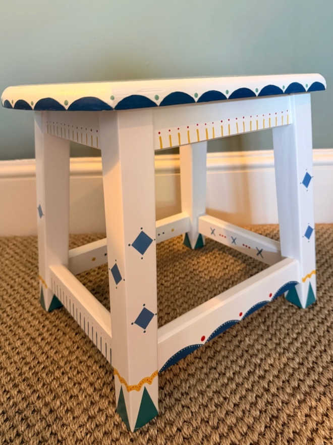 George Personalised Children’s Stool. A white and blue stool with intricate scalloping pattern.