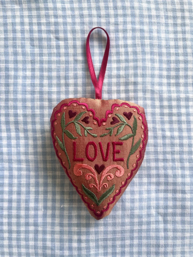 "LOVE" heart silk ornament with hearts, leaves and a scalloped edge (Peach silk with pink, green, peach and purple thread with a pink ribbon)