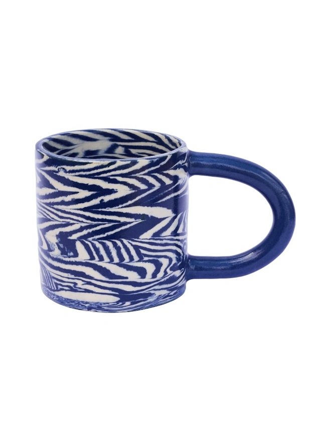 Herringbone Chunky Mug, a colourful mug sitting on a white surface against a plain backdrop. 