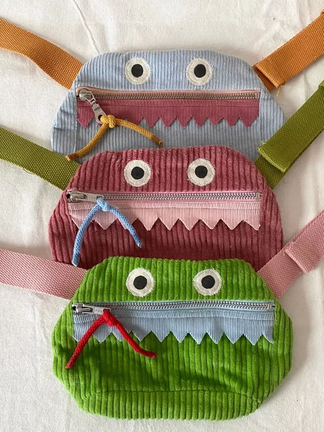 childrens pouch bum bag monster design in blue pink or green corduroy