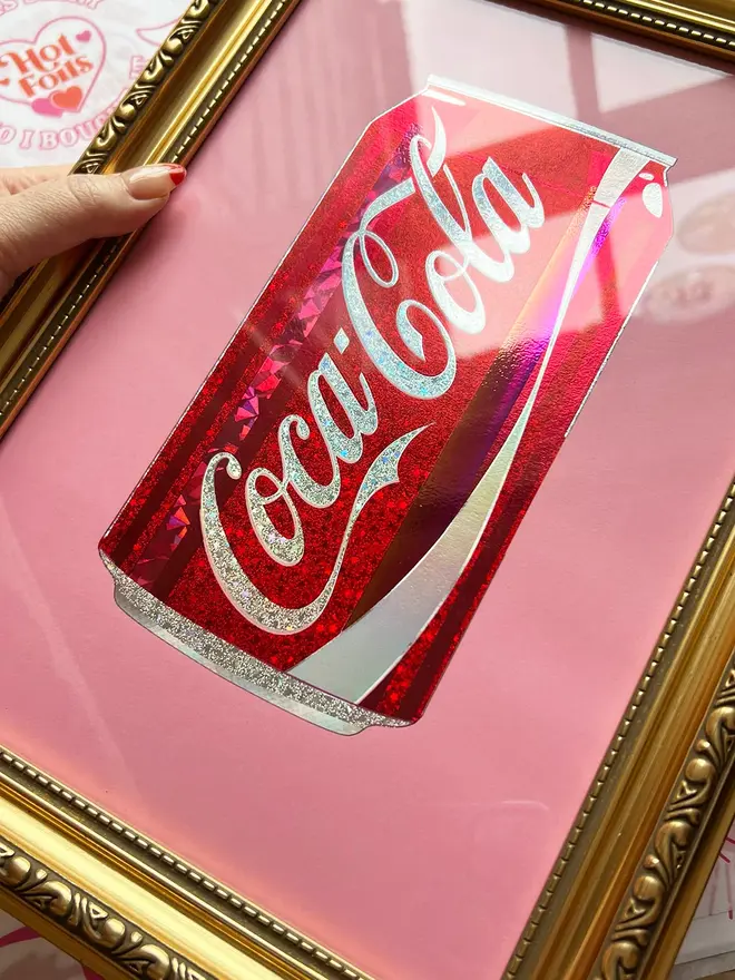 'Coca Cola' Can ScreenPrint, a person holding a colourful coca cola can print in a frame. 