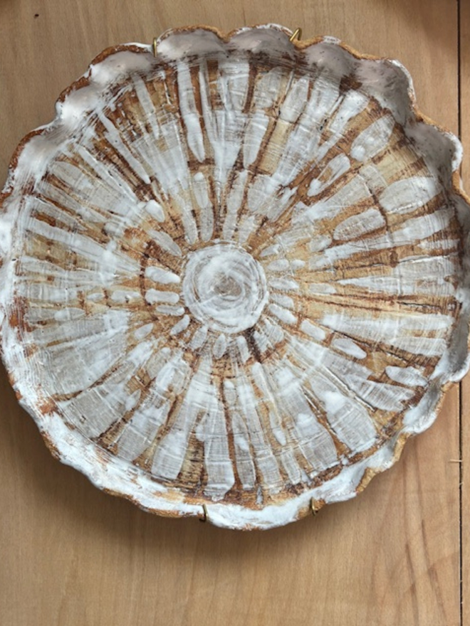 Ceramic shell plate